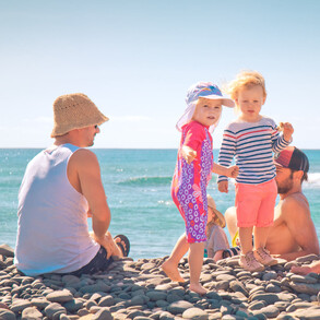 Surf camp with childcare, Parents with children on the beach