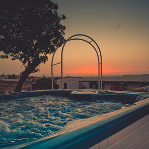 Watch the sunset in the whirlpool - this is our luxury surf camp