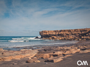 the waves of the small bay of La Bahia in La Pared